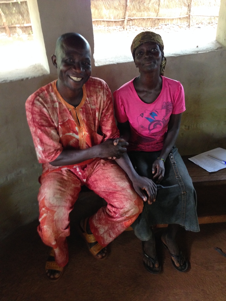 Gisèle (right) sits beside MSF counselor, Joseph Mbolingbagbe. 