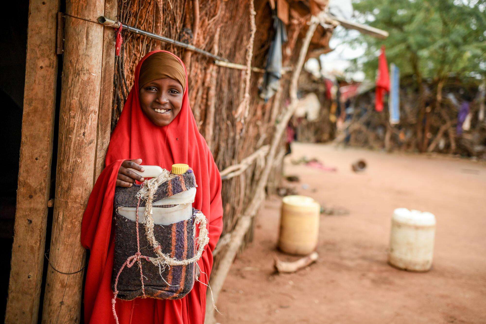 Ten-year-old Habiba, who lives with diabetes, holds the cooler bag in which she stores her insulin injections. Kenya, May 2021.