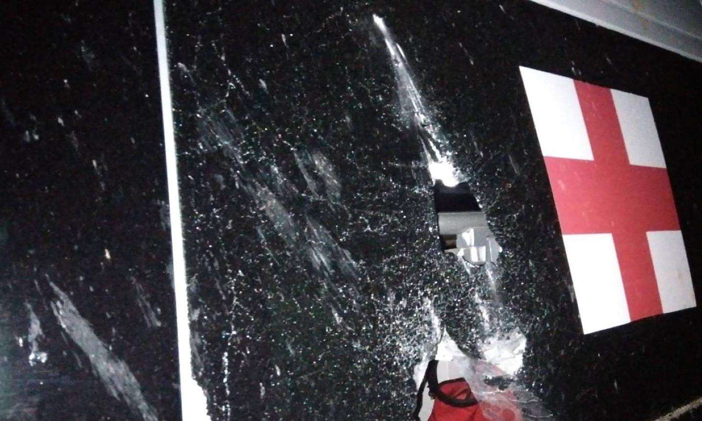 The partially shattered glass window of an MSF ambulance in Selydove.