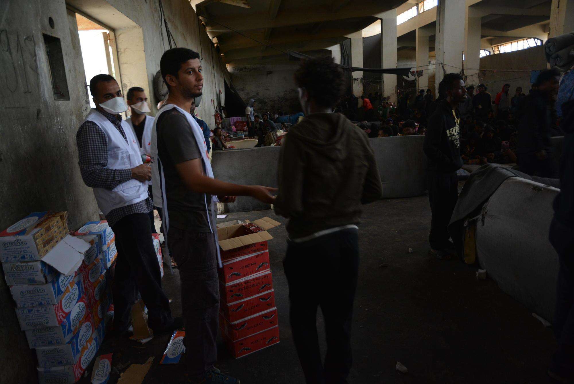 MSF teams conduct a food distribution in a detention center in Libya.