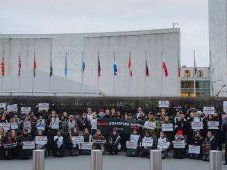 Doctors Without Borders staff hold a vigil calling for a ceasefire in Gaza at the UN headquarters in New York.