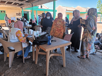 An MSF mobile clinic and displaced patients in Port Sudan.