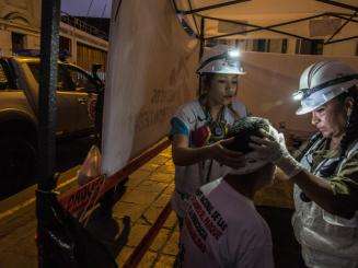 Treating people injured during the protests in Lima