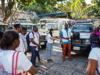 MSF staff stand in a circle at the mobile clinic in Bel Air, Haiti