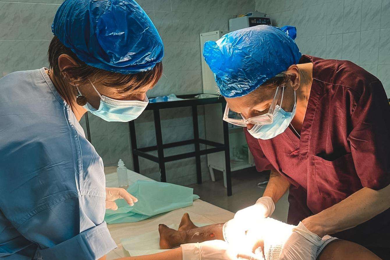 Two doctors perform surgery on a patient at Bashair Teaching Hospital in Khartoum, Sudan.
