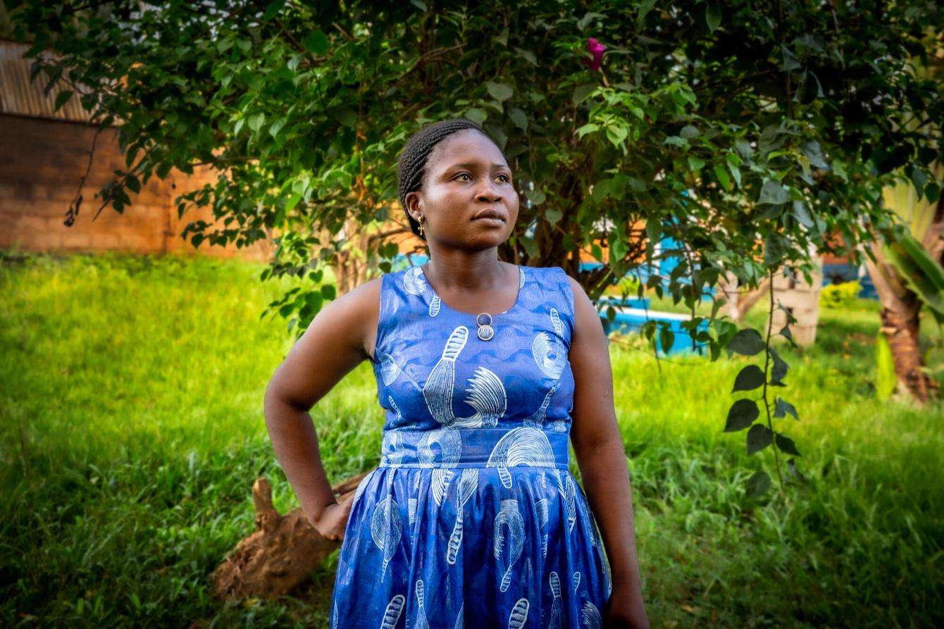 Woman in a blue dress in Bangui, Central African Republic