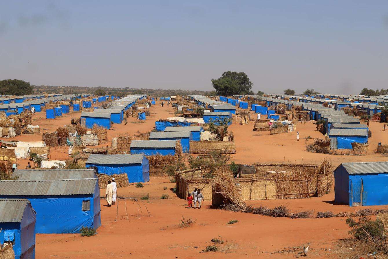 Makeshift shelters made of blue tarp at Ourang refugee camp, eastern Chad