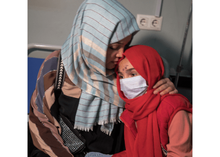 A mother hugs her daughter at Mazar-i-Sharif Regional Hospital in Balkh province, Afghanistan.