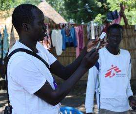MSF staff prepare a vaccination during a routine childhood vaccination campaign in a small village near Old Fangak.